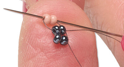Beads threaded with a needle